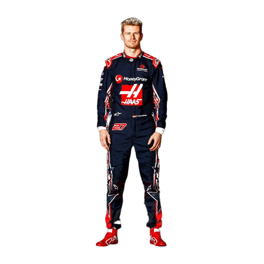 Nico Hülkenberg standing confidently in his 2023 Austin Grand Prix racing suit, featuring a deep navy blue base adorned with red accents and subtle star patterns