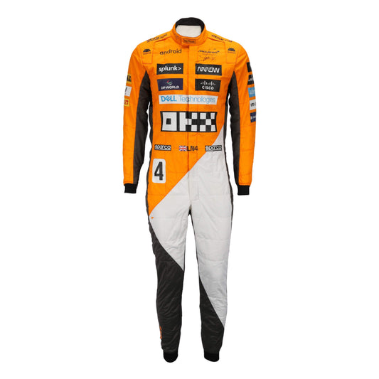Lando Norris in the 2023 'Triple Crown' Spanish GP race suit featuring a tribute design with refined graphics and modern tailoring.